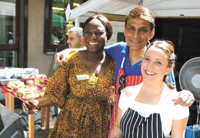 Bank of kindness: City slickers help out Great Croft Resource Centre manager Abul Choudhury with volunteers from Rothschild & Co Loretta Awuah (left) and Jamie Longley