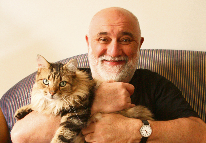 Alexei Sayle with cat Wilf Mbanga.