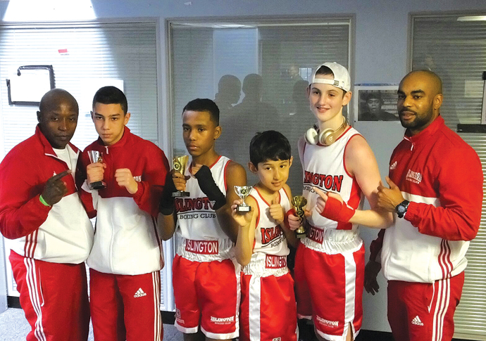 Boxers lace up their gloves for roadshows Islington BC Boxers coaches at Aylesbury show - with medals