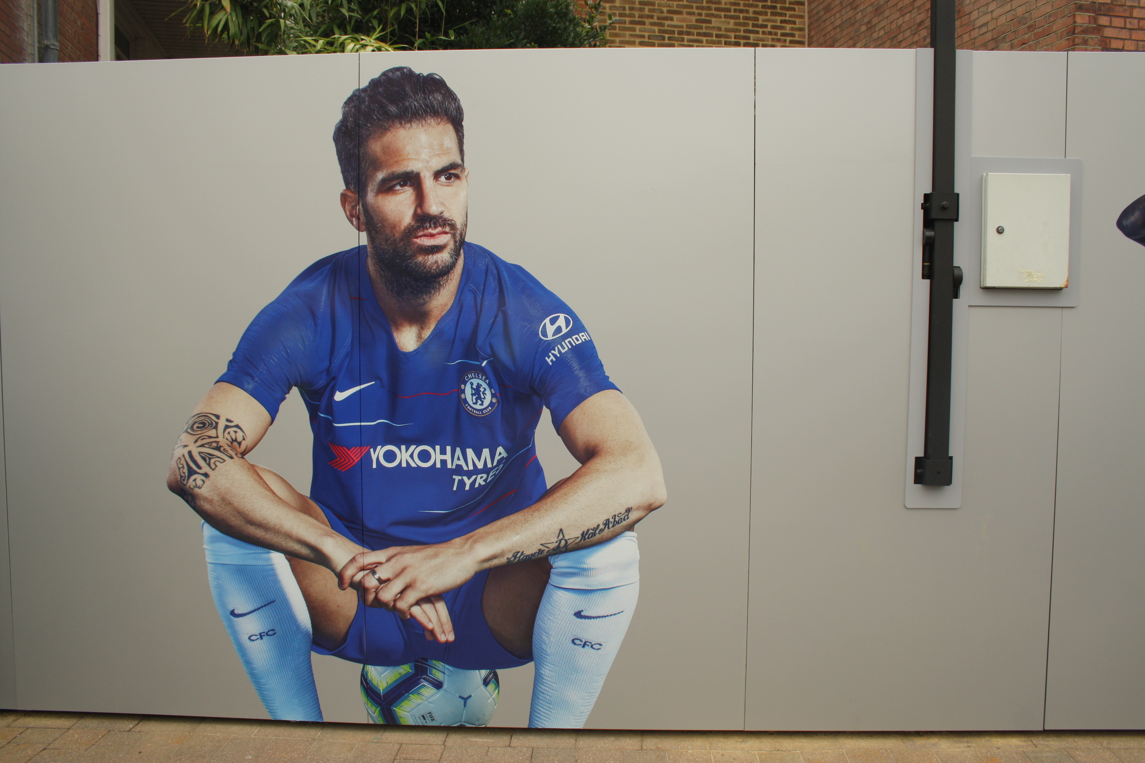 Not such a fab send-off for Cesc Cesc Fabregas poster outside Stamford Bridge Chelsea kit