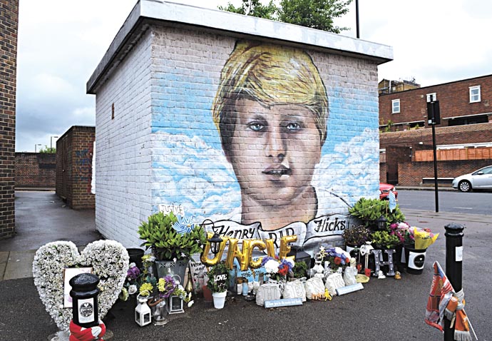 Henry Hicks mural is saved from whitewash Henry-Hicks_floral-tributes_mural
