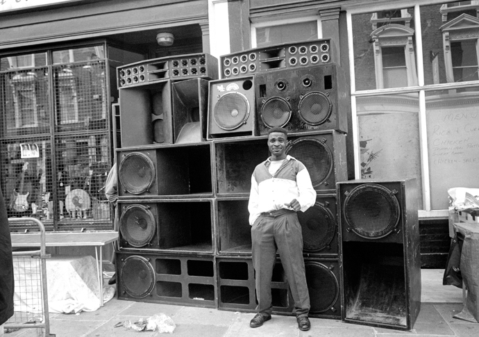 Man standing in front of some speakers, Notting Hill Carnival