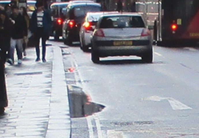 Water will not flow uphill puddle - High Holborn