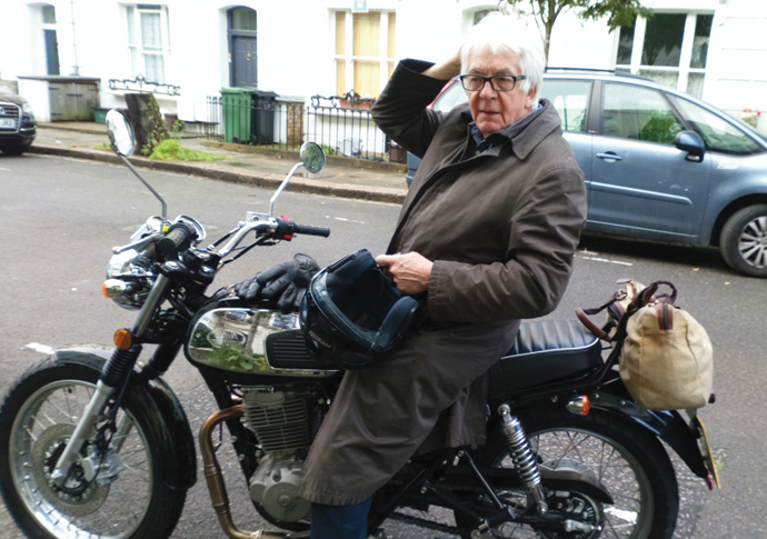 Man on a motorcycle mission over parking Brian Lake_New Motorbike