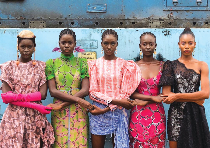 Models holding hands Lagos Nigeria 2019. By Stephen Tayo Courtesy Lagos Fashion Week