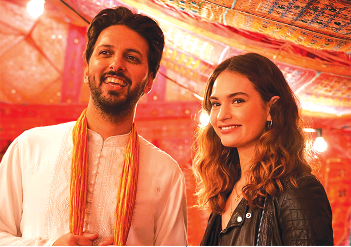 Shazad Latif and Lily James in What's Love Got to Do with It Robert Viglasky-Robert Viglasky