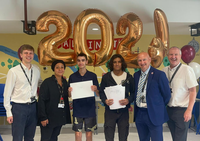 Staff incl Headteacher Mr Ardron with top achieving students